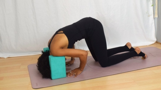 bring the crown of your head to the floor