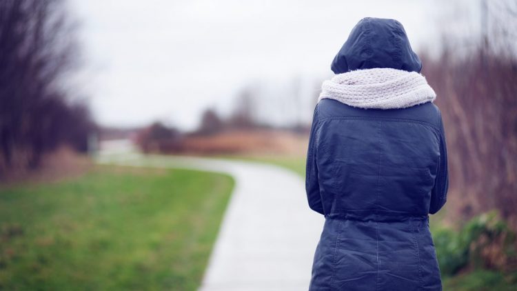 hunched shoulders on a gray day